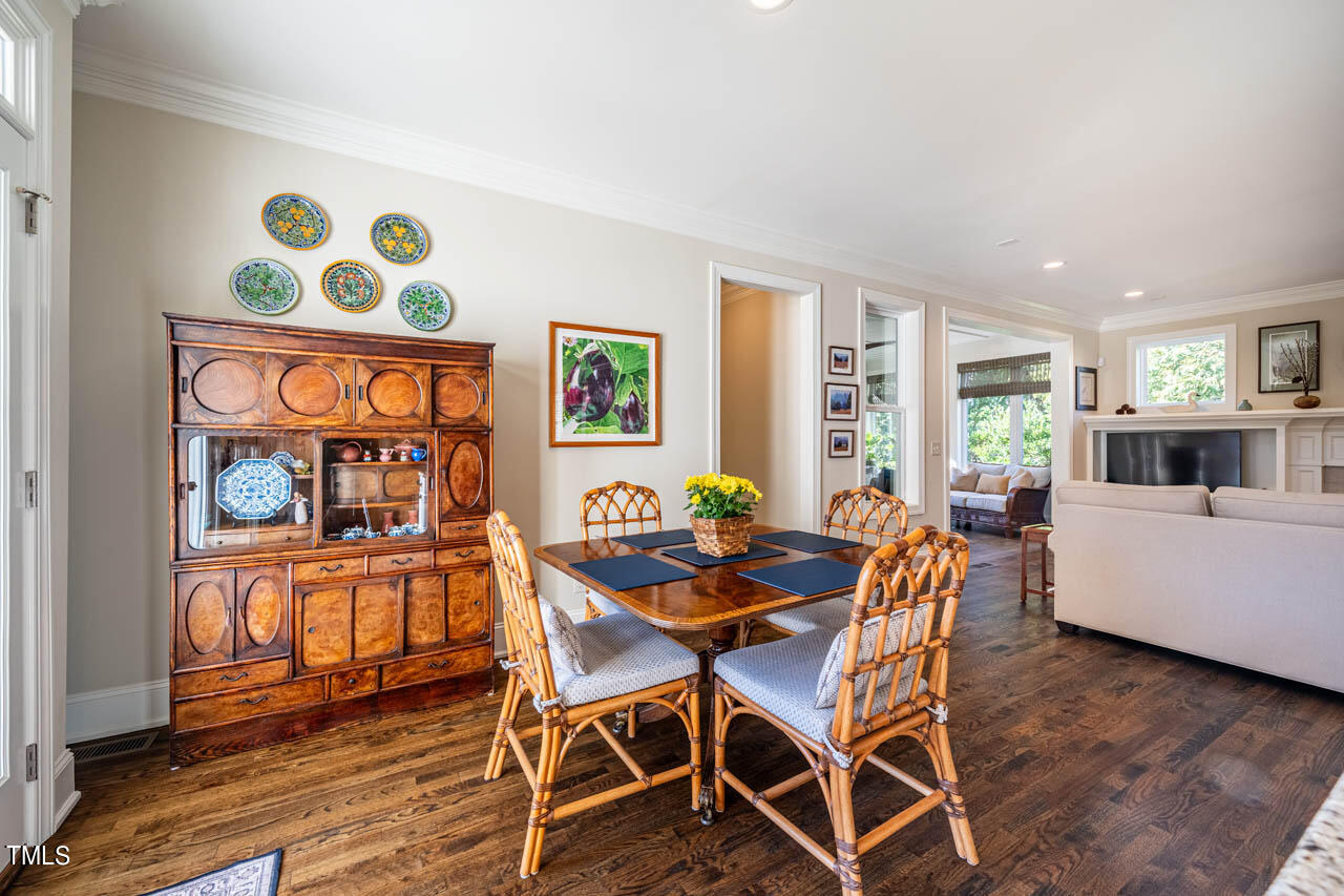 499 Bennett Mountain Trace Chapel Hill, NC 27516 - Photo 27 of 75 a dining room with furniture a window and wooden floor