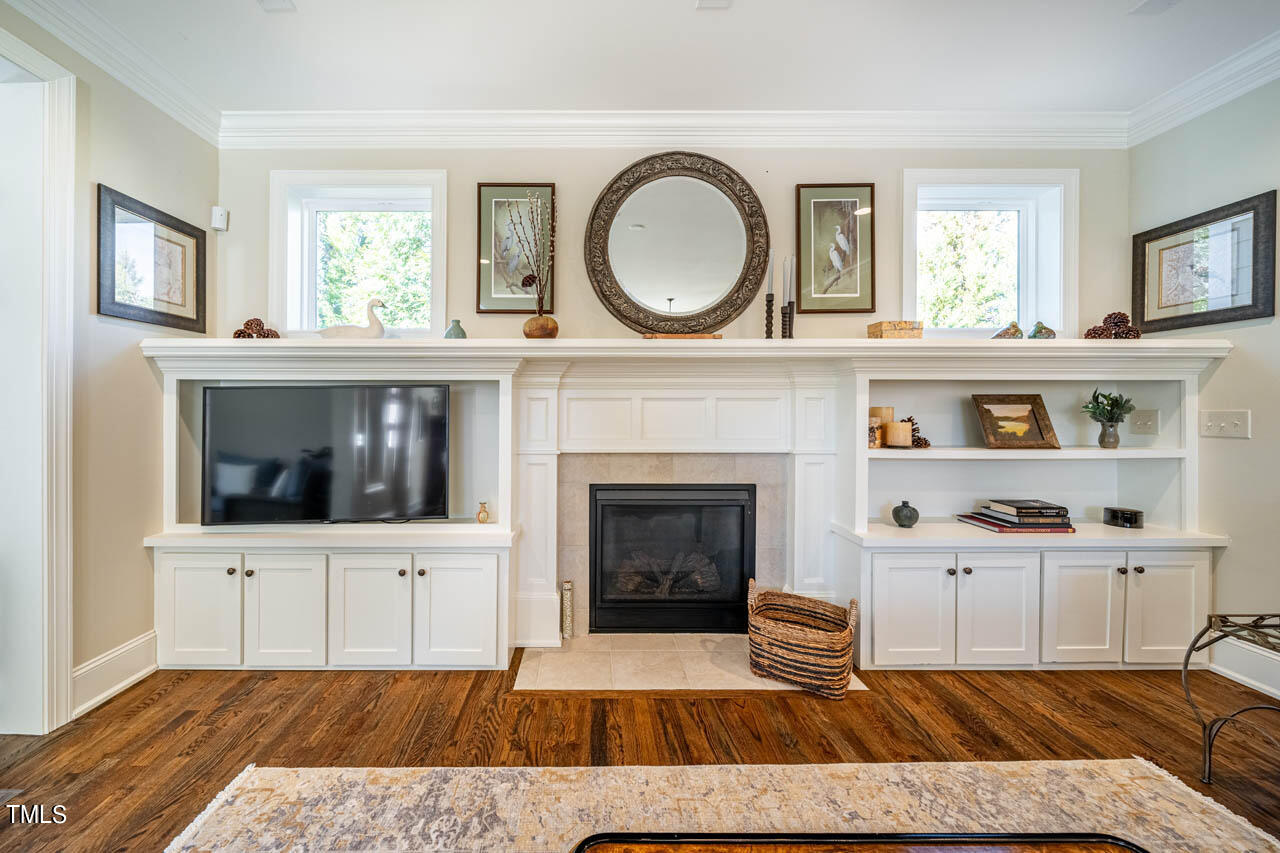 499 Bennett Mountain Trace Chapel Hill, NC 27516 - Photo 33 of 75 a living room with furniture and a fireplace