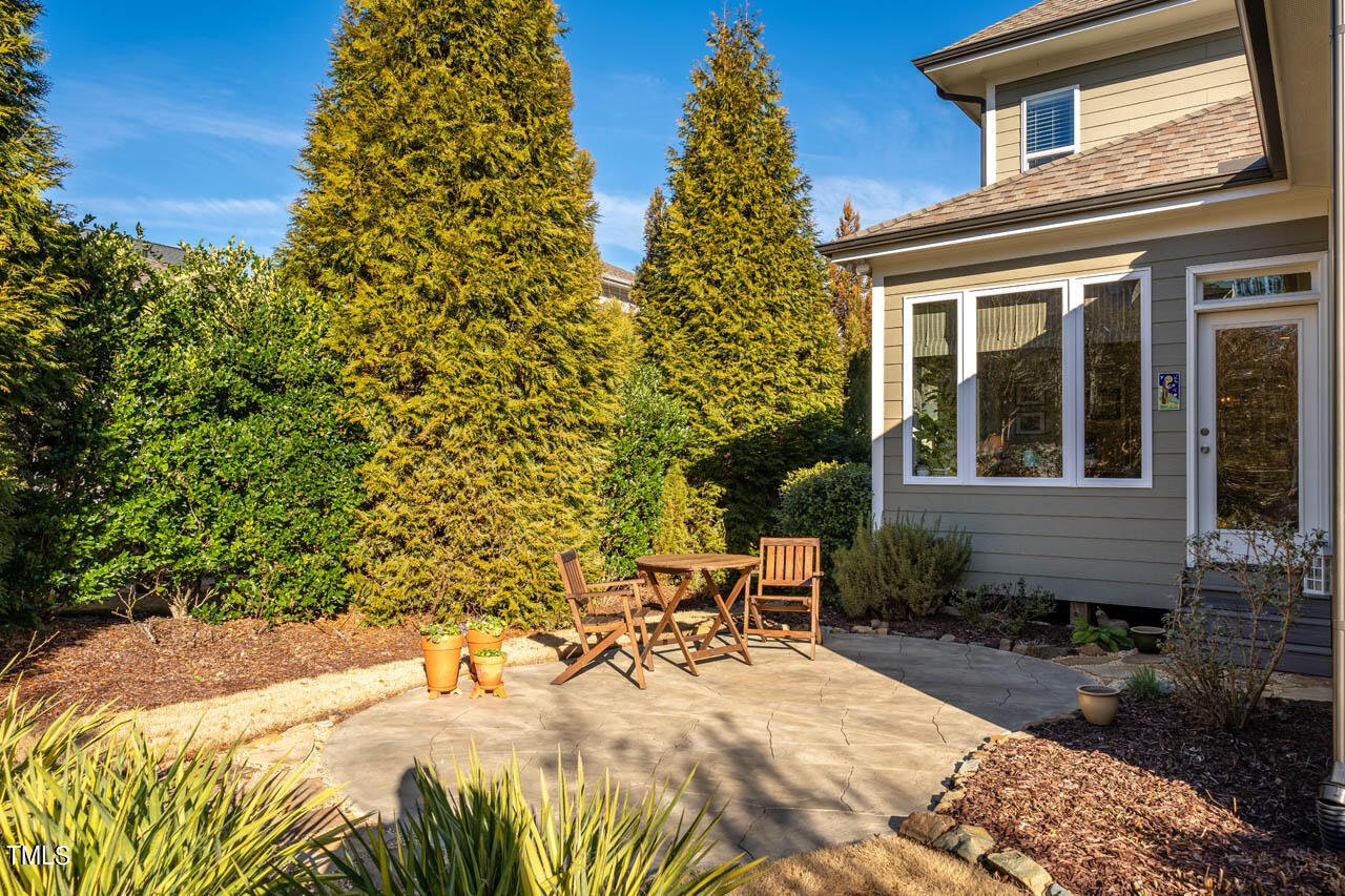 499 Bennett Mountain Trace Chapel Hill, NC 27516 - Photo 38 of 75 a view of a chair and table in the backyard