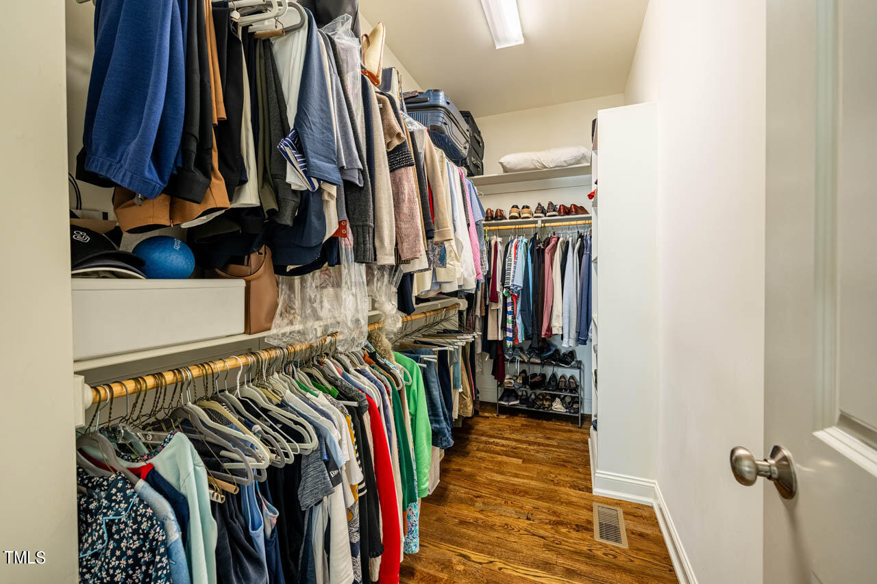 499 Bennett Mountain Trace Chapel Hill, NC 27516 - Photo 45 of 75 a view of walk in closet with clothes and shoes