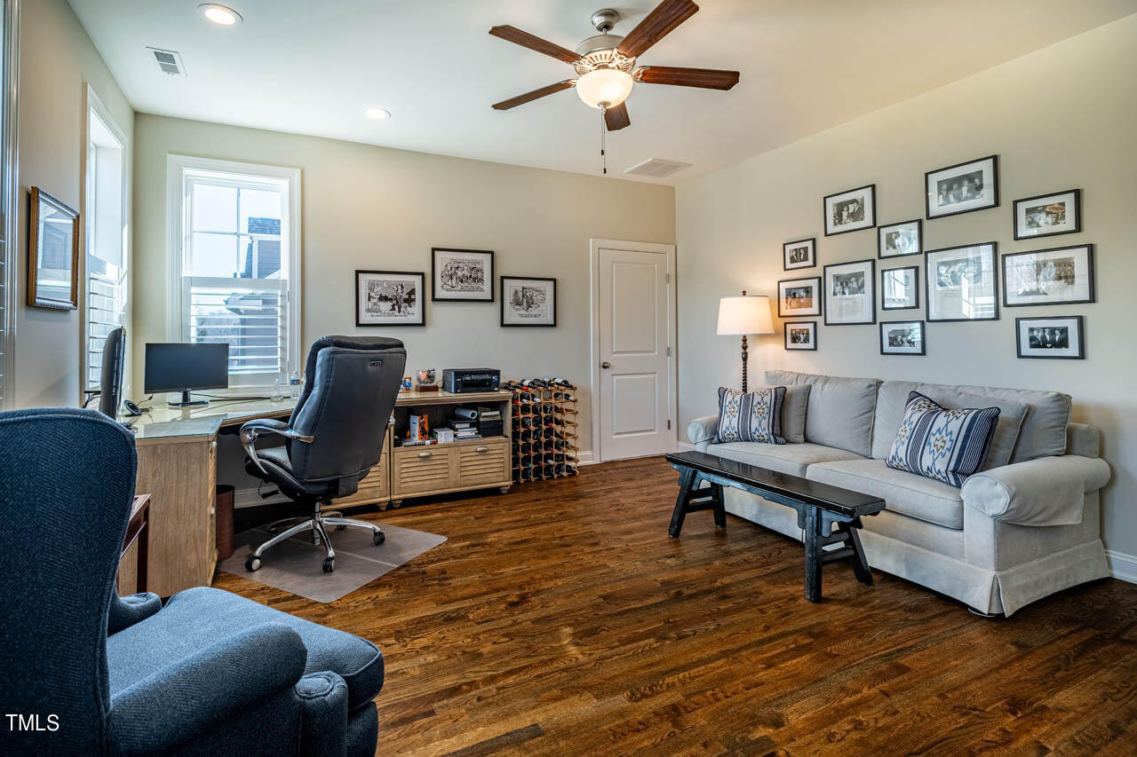499 Bennett Mountain Trace Chapel Hill, NC 27516 - Photo 47 of 75 a view of a livingroom with workspace and a couch