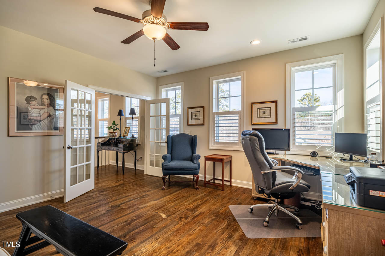 499 Bennett Mountain Trace Chapel Hill, NC 27516 - Photo 48 of 75 a view of a workspace with furniture and a window