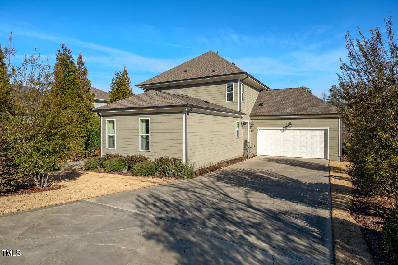 499 Bennett Mountain Trace Chapel Hill, NC 27516 - Photo 57 of 75 a front view of a house with a yard