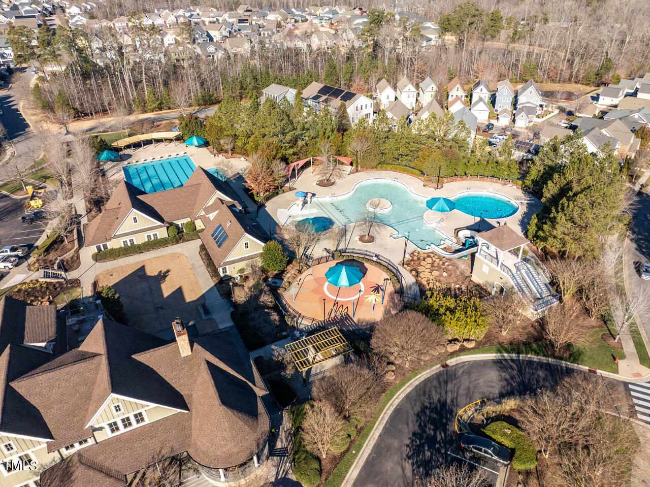 499 Bennett Mountain Trace Chapel Hill, NC 27516 - Photo 66 of 75 an aerial view of a swimming pool patio and mountain view in back