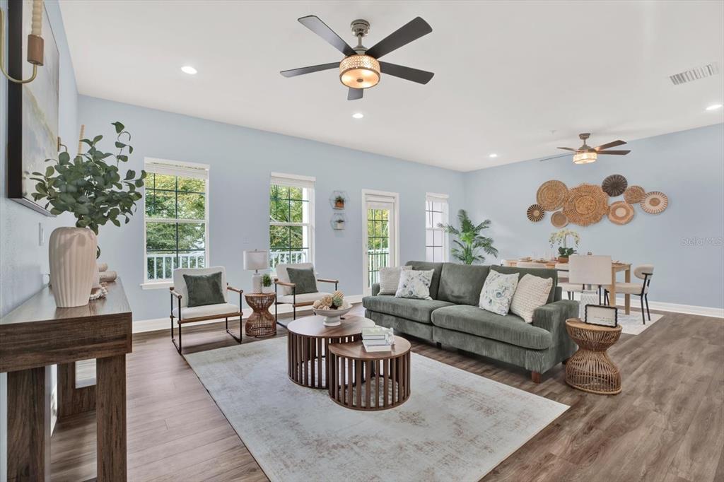 4529 Bay Spring Court Tampa, FL 33611 - Photo 12 of 66 a living room with furniture potted plant and a chandelier