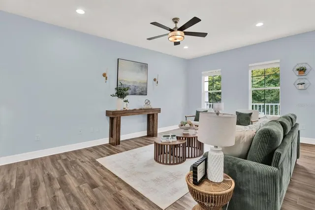 a view of a dining room with furniture and wooden floor