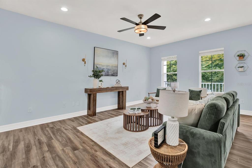 4529 Bay Spring Court Tampa, FL 33611 - Photo 13 of 66 a living room with furniture and wooden floor