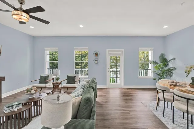 a view of a dining room that has a table and a chandelier
