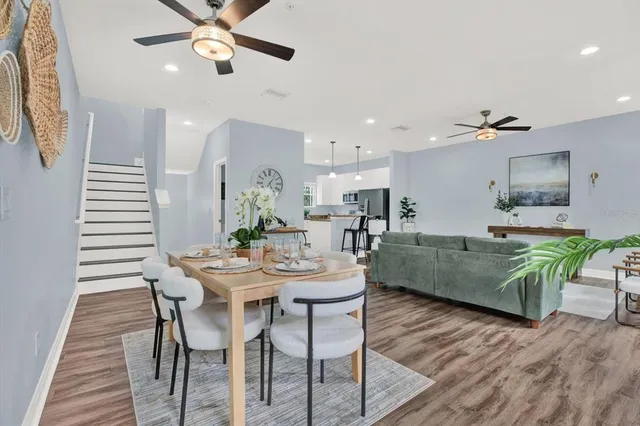 a view of a dining room with furniture and wooden floor