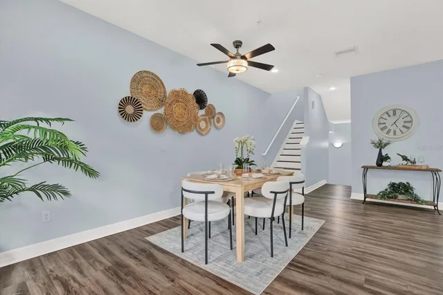 a kitchen with granite countertop a sink stainless steel appliances and cabinets