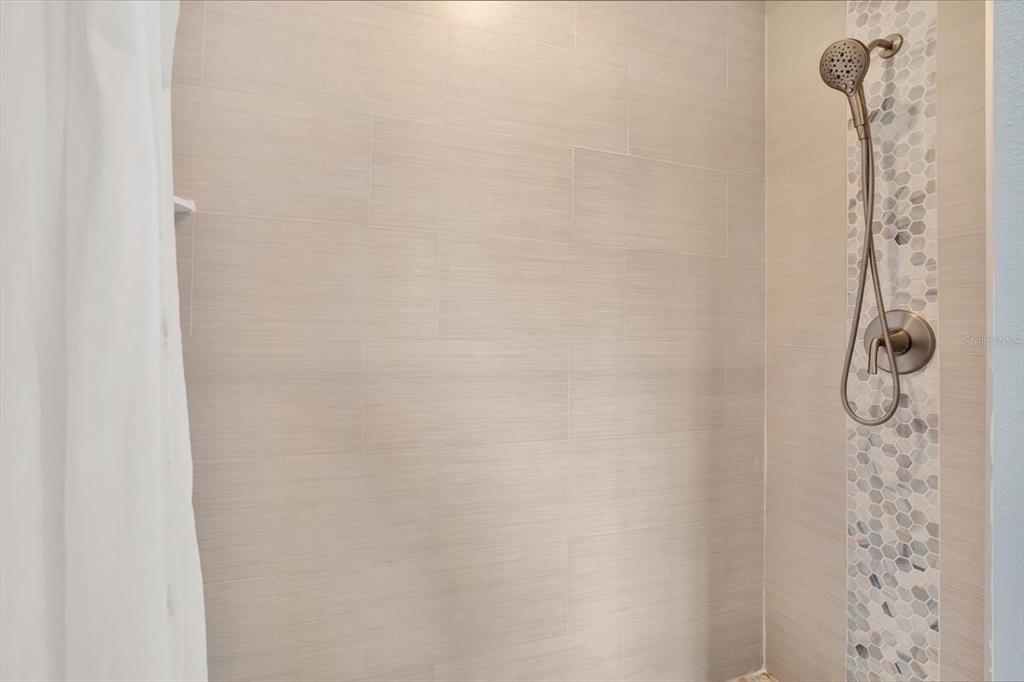 4529 Bay Spring Court Tampa, FL 33611 - Photo 28 of 66 a bathroom with a shower