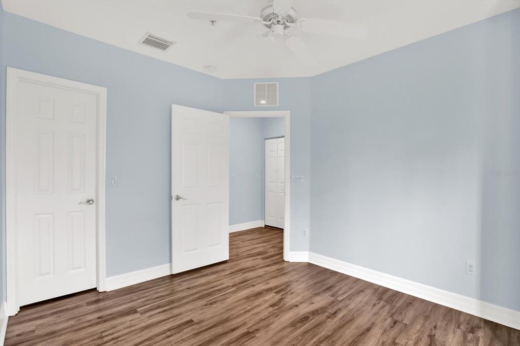 4529 Bay Spring Court Tampa, FL 33611 - Photo 30 of 66 a view of an empty room with wooden floor