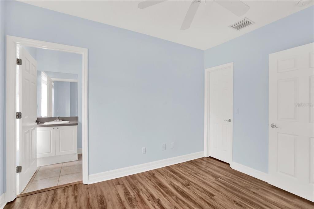 4529 Bay Spring Court Tampa, FL 33611 - Photo 31 of 66 a view of an empty room with wooden floor