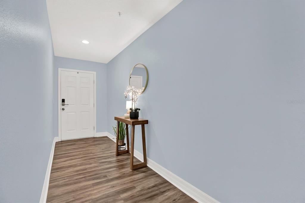 4529 Bay Spring Court Tampa, FL 33611 - Photo 34 of 66 a view of a livingroom with wooden floor