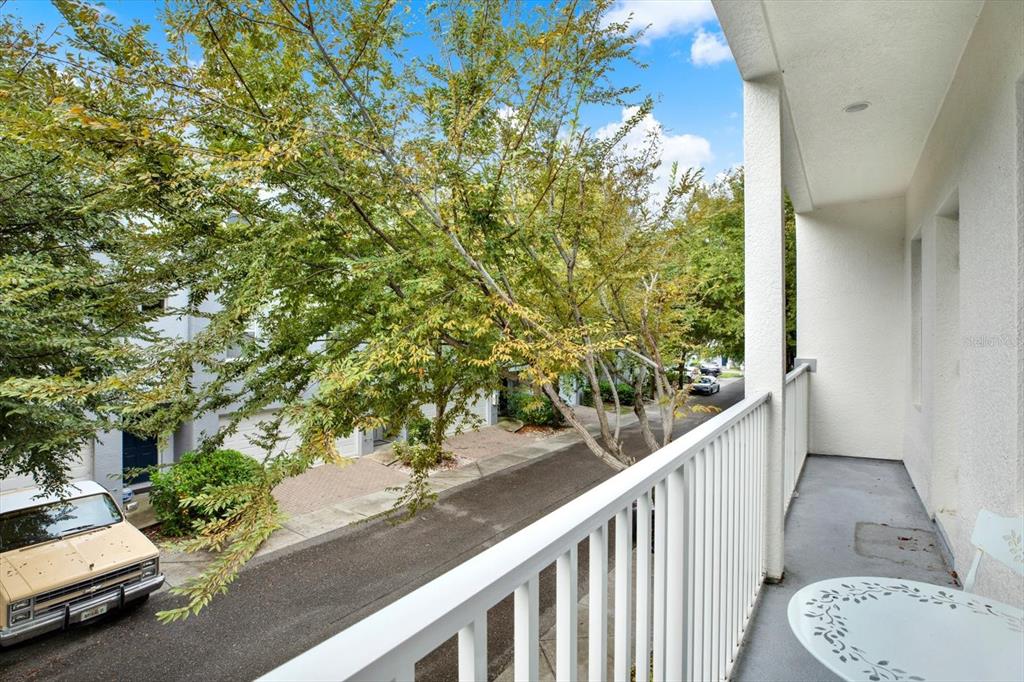 4529 Bay Spring Court Tampa, FL 33611 - Photo 40 of 66 a view of a balcony with chair and table