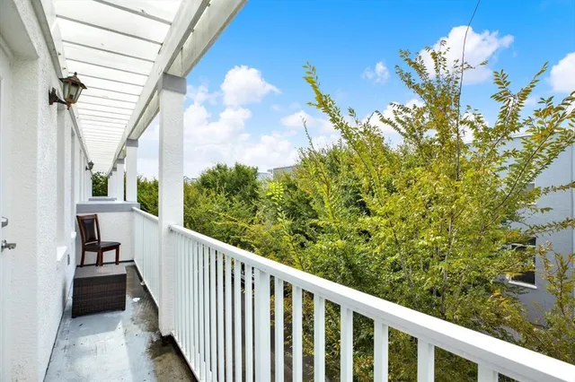 an aerial view of residential houses with city view