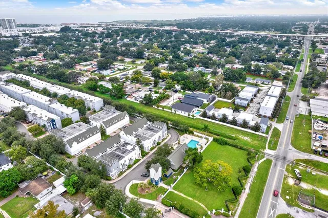 an aerial view of residential houses with outdoor space