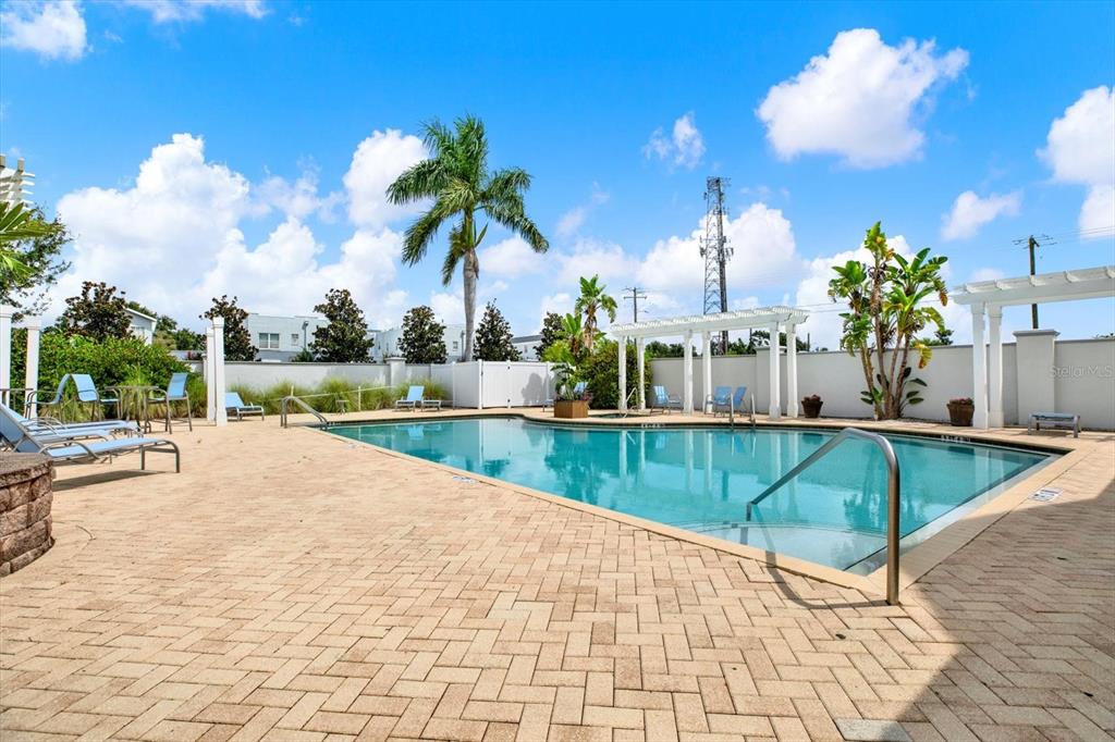 4529 Bay Spring Court Tampa, FL 33611 - Photo 58 of 66 a swimming pool with an outdoor space and seating area
