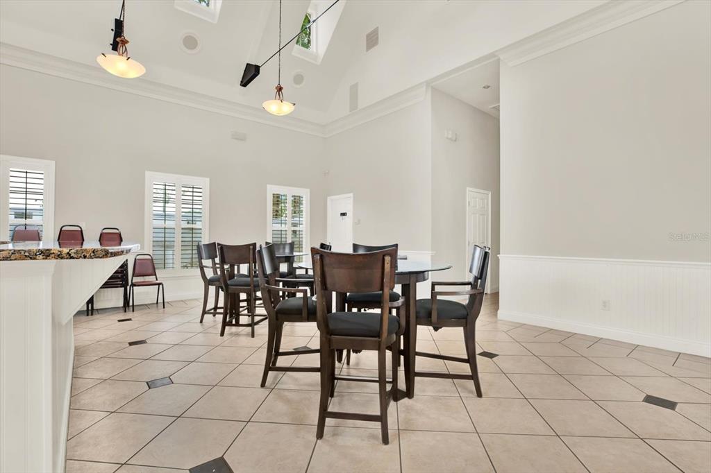 4529 Bay Spring Court Tampa, FL 33611 - Photo 60 of 66 a view of a dining room with furniture