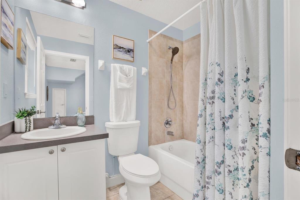 4529 Bay Spring Court Tampa, FL 33611 - Photo 7 of 66 a bathroom with a sink toilet and shower