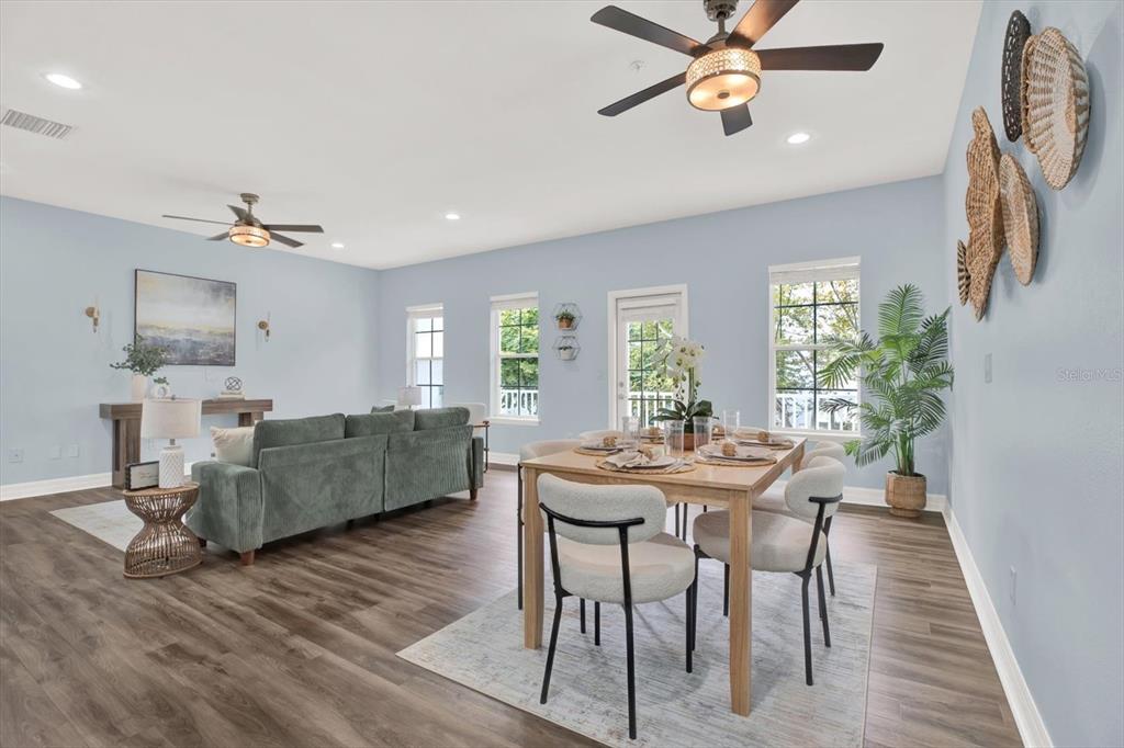 4529 Bay Spring Court Tampa, FL 33611 - Photo 8 of 66 a view of a dining room with furniture and a chandelier