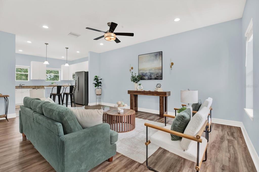 4529 Bay Spring Court Tampa, FL 33611 - Photo 9 of 66 a living room with furniture and a flat screen tv