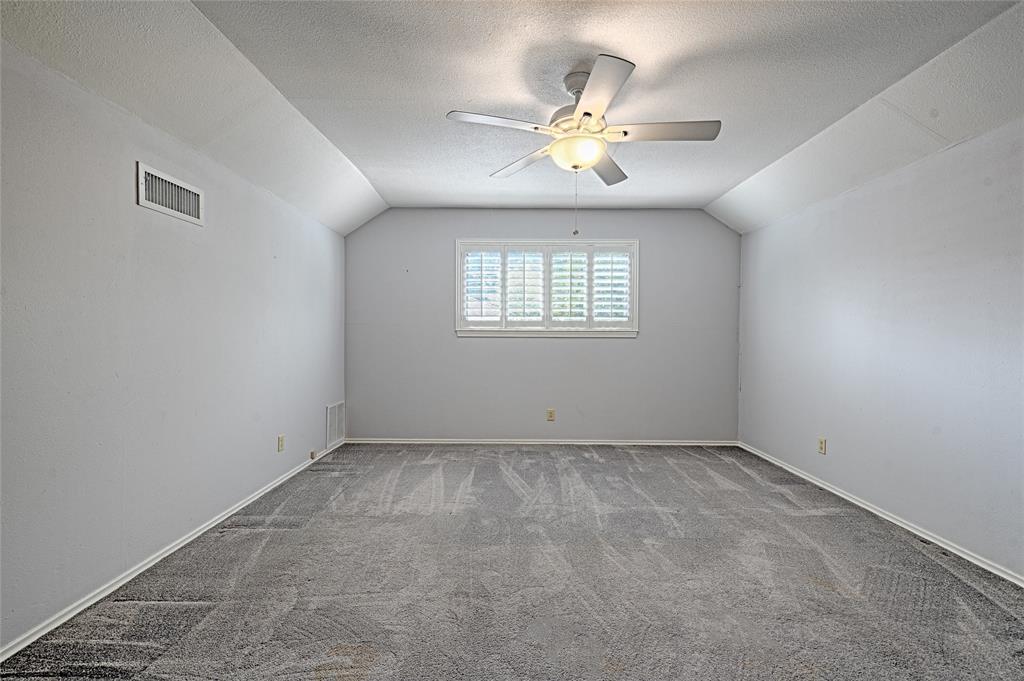 3004 Wingren Road Irving, TX 75062 - Photo 15 of 18 Vaulted ceiling with a ceiling fan light fixture