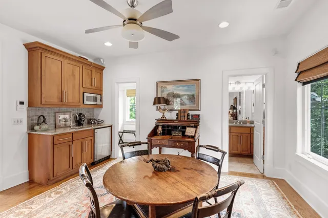a dining room with furniture and window