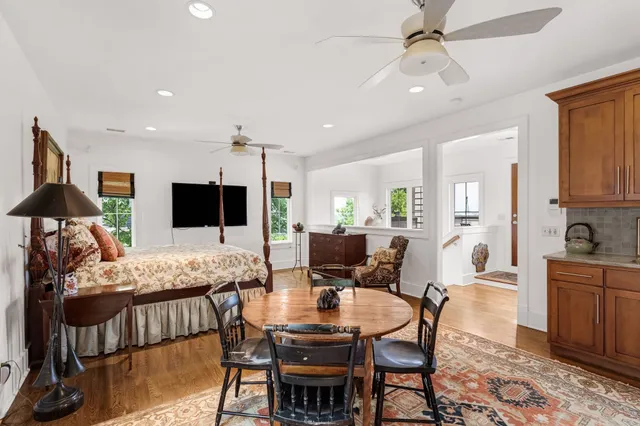 a view of a dining room with furniture and wooden floor