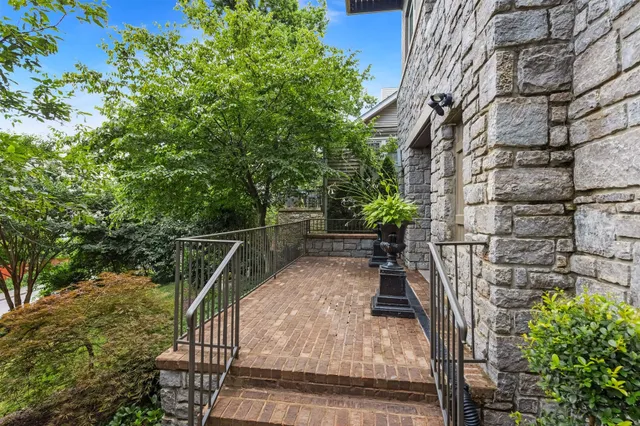 a view of balcony with wooden floor and fence