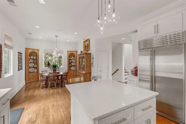 a view of a kitchen and dining room