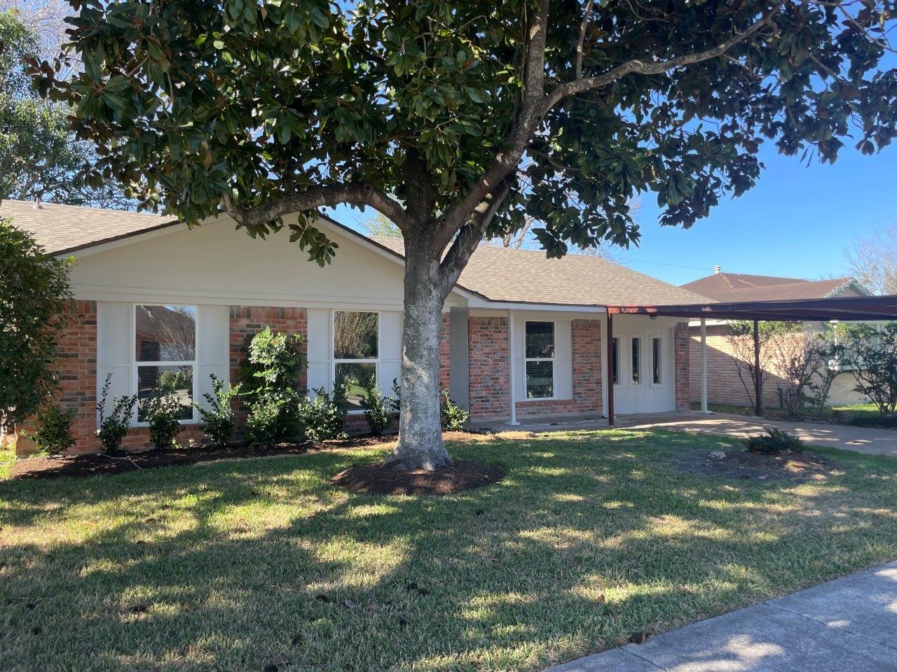 a front view of a house with a yard and porch