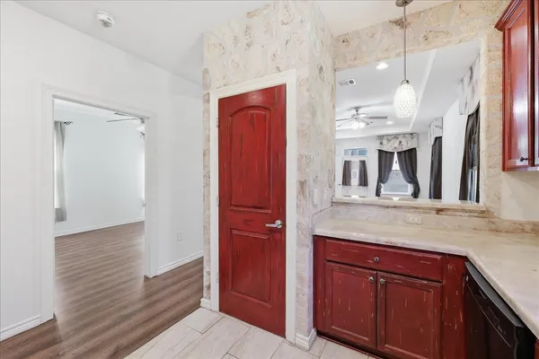 a view of a kitchen from the hallway