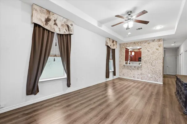 a view of an entryway with wooden floor