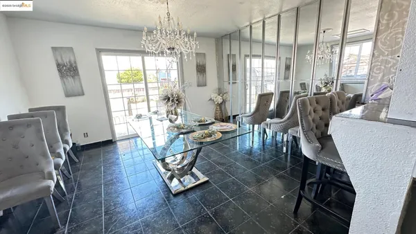 a view of a dining room with furniture window and outside view