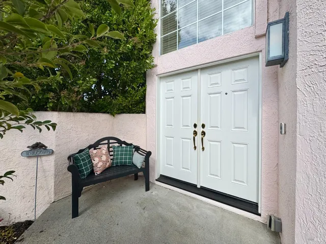 a view of balcony with furniture
