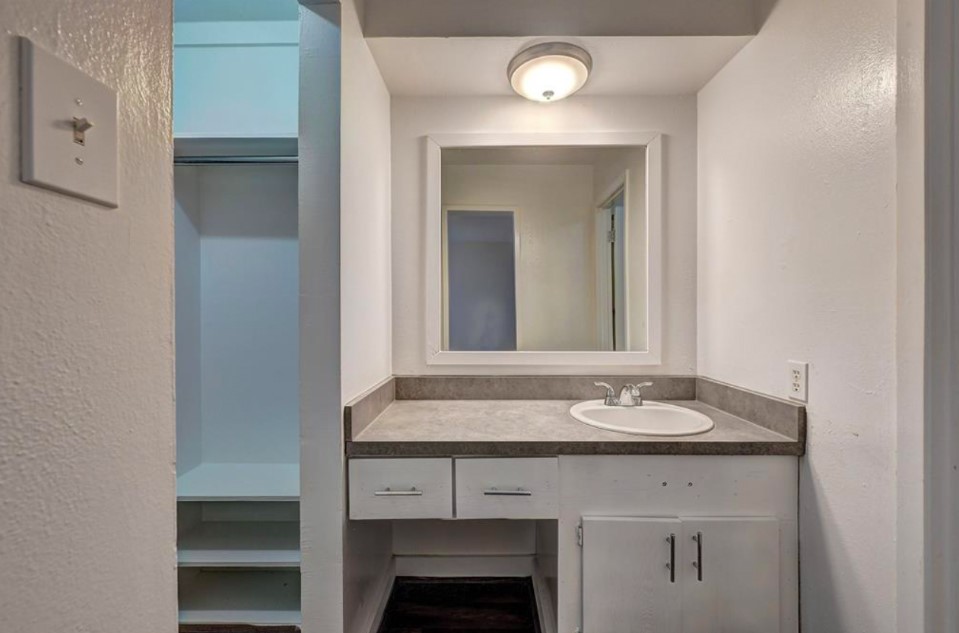 2322 Dunlavy Street, Unit 6 Houston, TX 77006 - Photo 3 of 6 a bathroom with a sink and a mirror