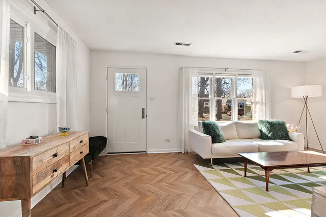 a living room with furniture and a table