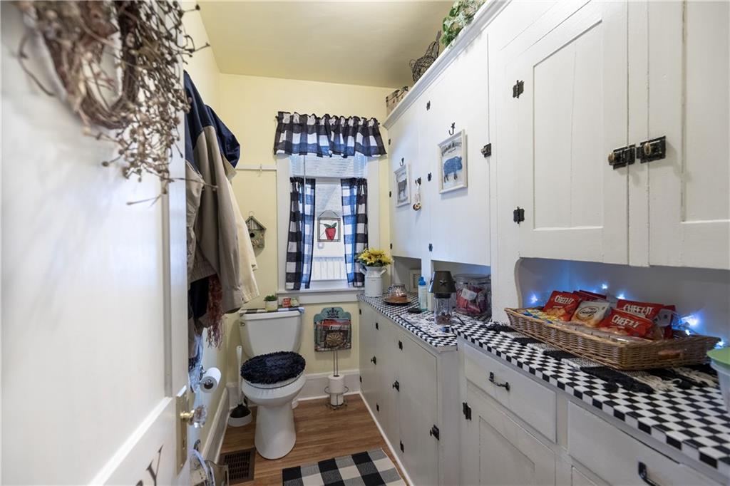626 West Main Street Everett, PA 15537 - Photo 11 of 32 a kitchen with stainless steel appliances a white cabinets and a stove