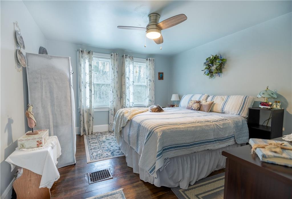 626 West Main Street Everett, PA 15537 - Photo 16 of 32 a bedroom with a bed and wooden floor