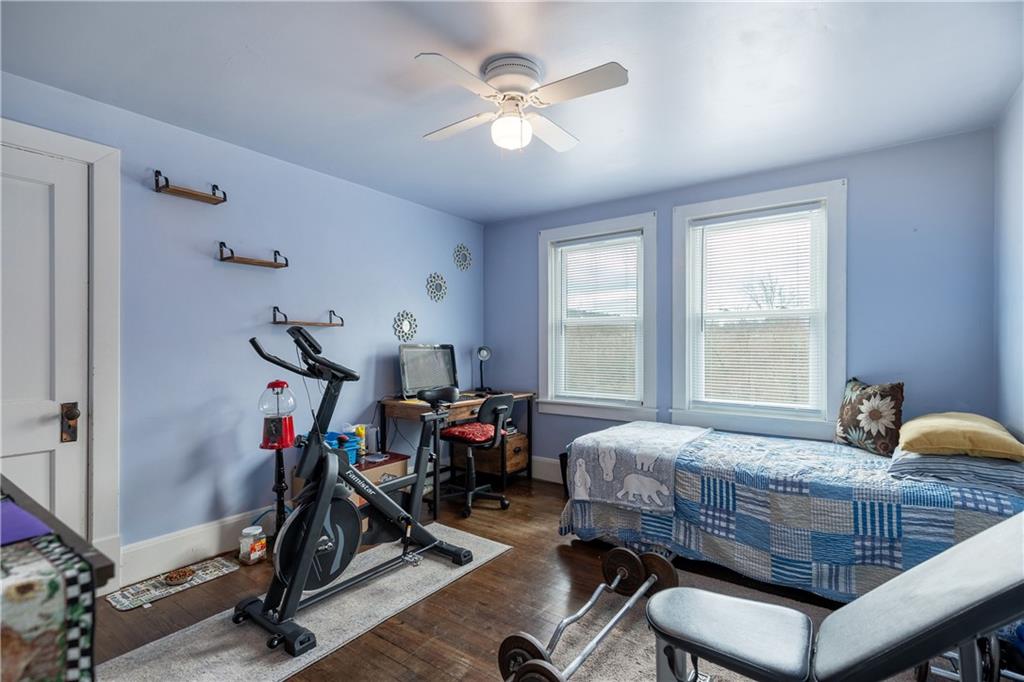 626 West Main Street Everett, PA 15537 - Photo 18 of 32 a bedroom with bed a flat screen tv and a large window