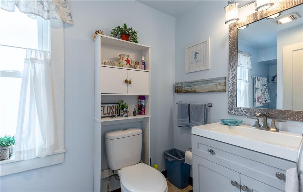 626 West Main Street Everett, PA 15537 - Photo 20 of 32 a bathroom with a toilet sink and mirror