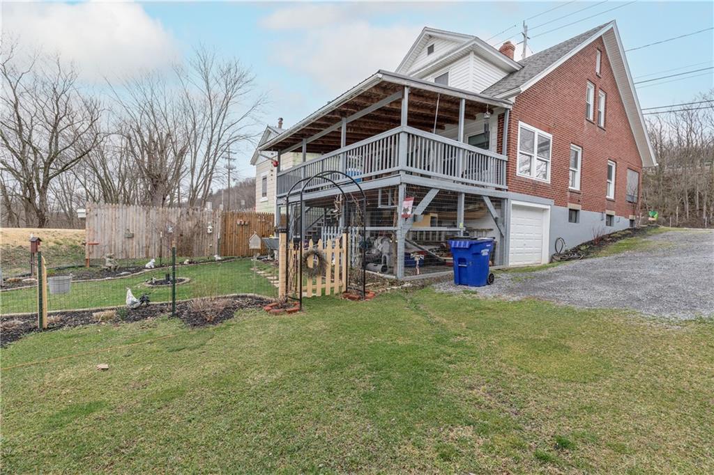 626 West Main Street Everett, PA 15537 - Photo 26 of 32 a view of a big house with a big yard and large trees