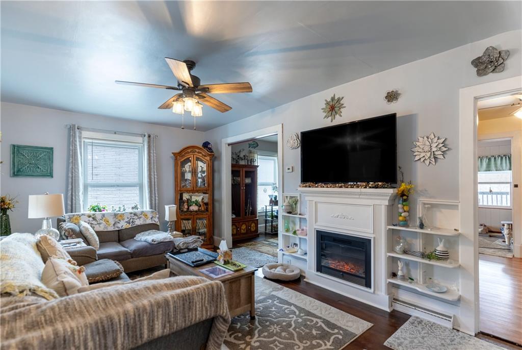 626 West Main Street Everett, PA 15537 - Photo 7 of 32 a living room with furniture a flat screen tv and a fireplace