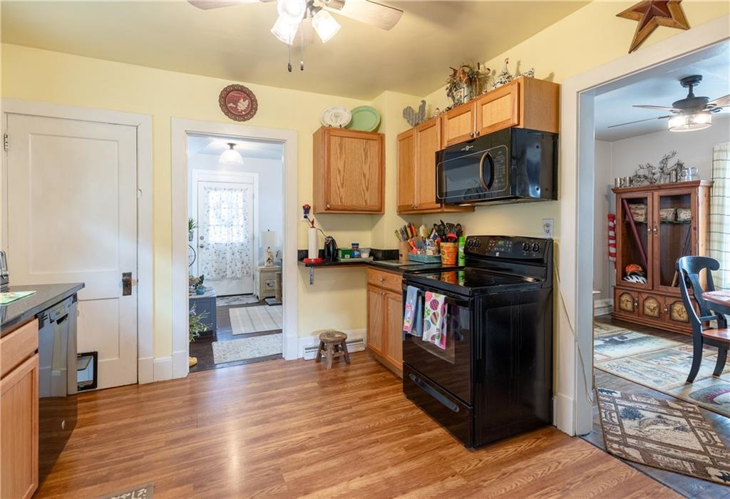 626 West Main Street Everett, PA 15537 - Photo 10 of 32 a kitchen with stainless steel appliances granite countertop a refrigerator stove and a sink
