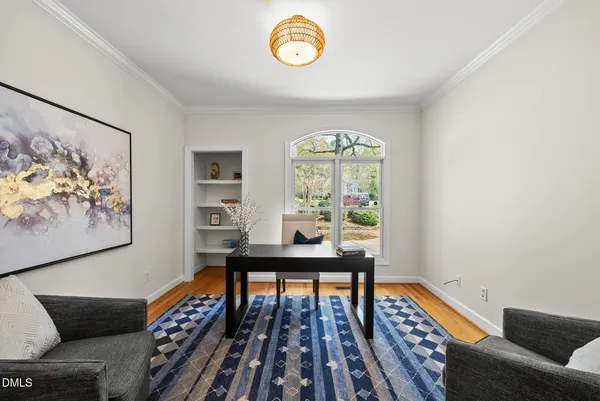 a view of a livingroom with furniture and a window