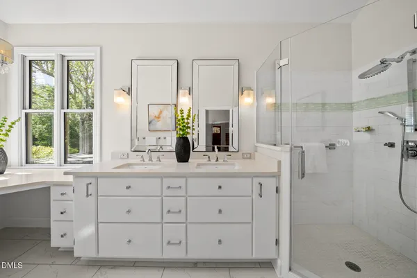 a bathroom with a granite countertop sink mirror and shower