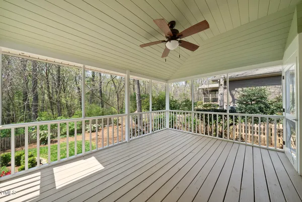 a view of a balcony with wooden floor