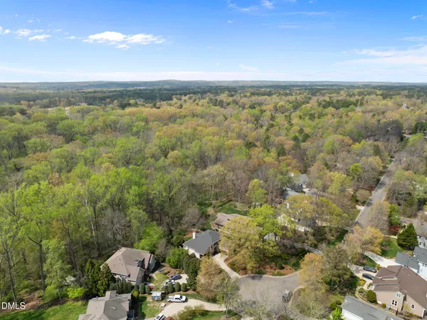 a aerial view of houses with yard