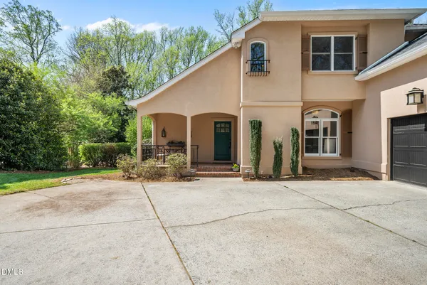 a view of a chairs and table in the balcony